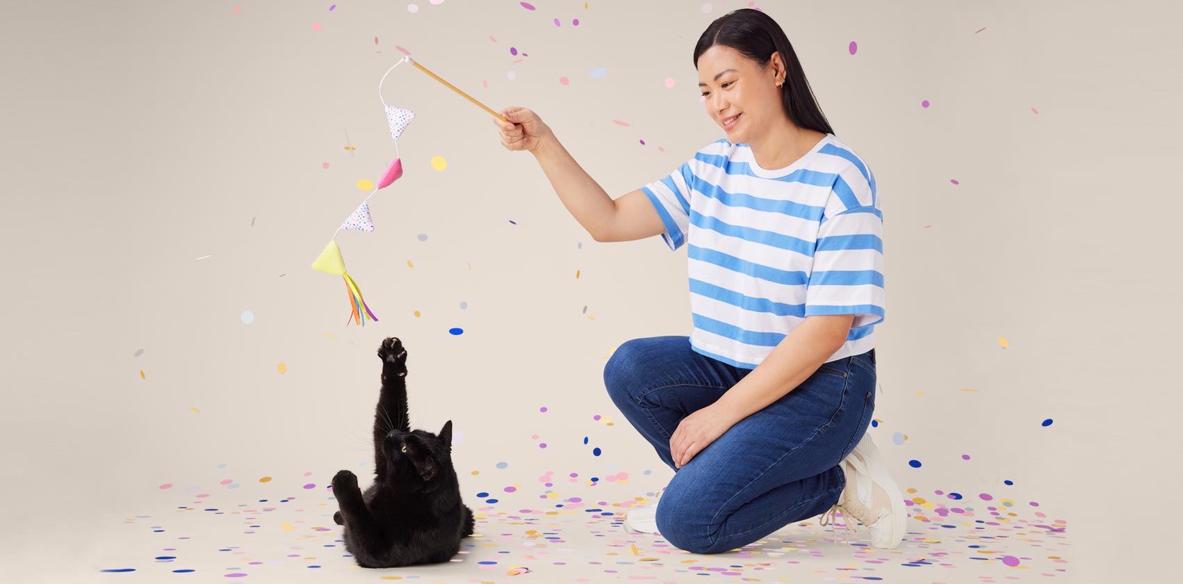 Fun ways to celebrate special occasions with your pet - A cat playing with the owner