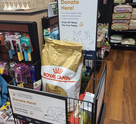Give Local. Help Local. - Royal Canin bag in Donation bin
